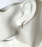 Sterling Silver Hammered Kiss Stud Earrings - Image 1