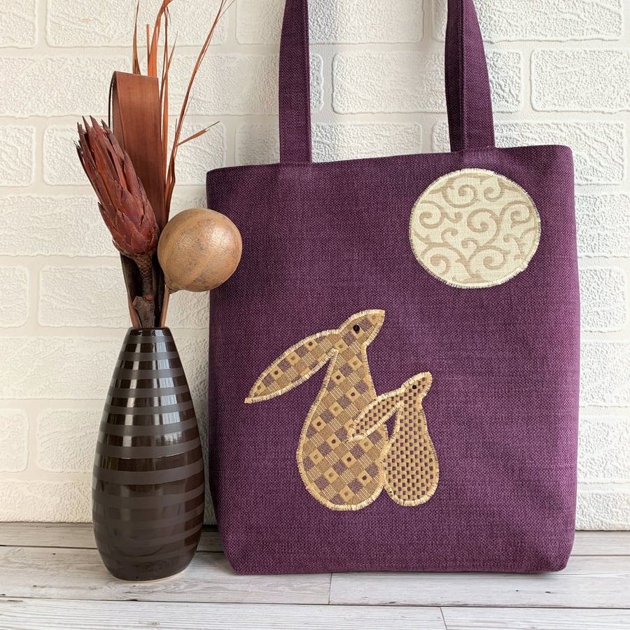 Purple tote bag with moon gazing hares