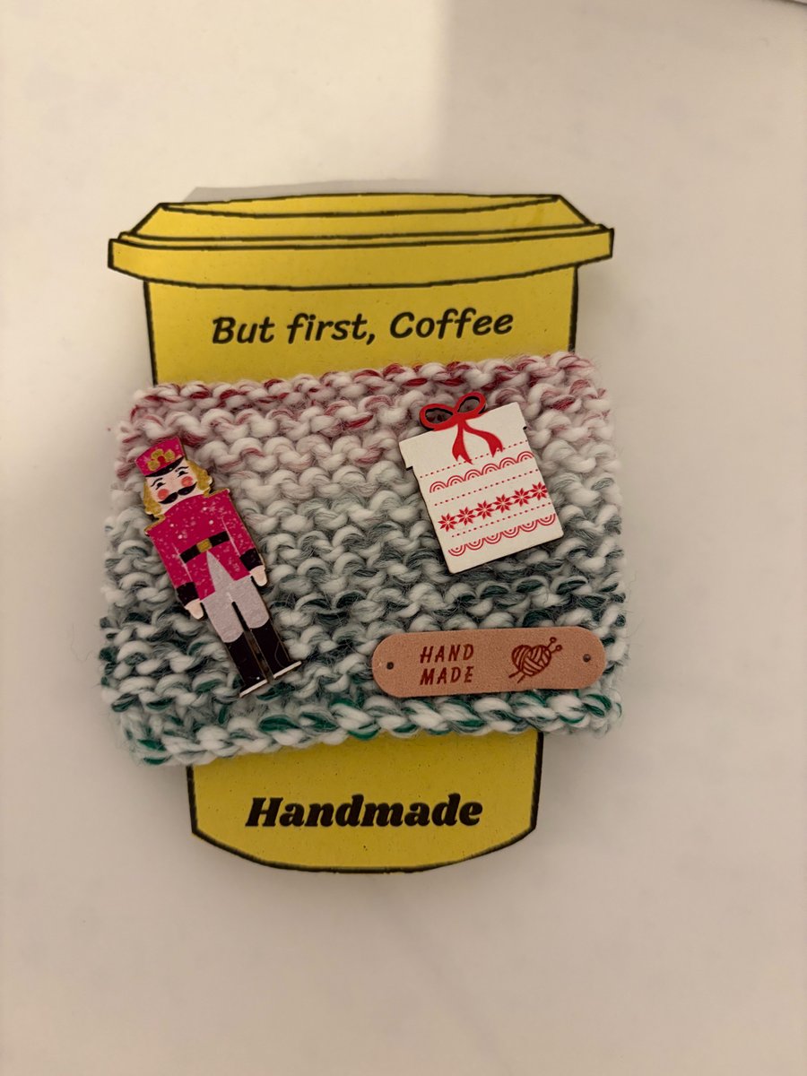 Christmas parcel and nutcracker knitted cup cosy. 