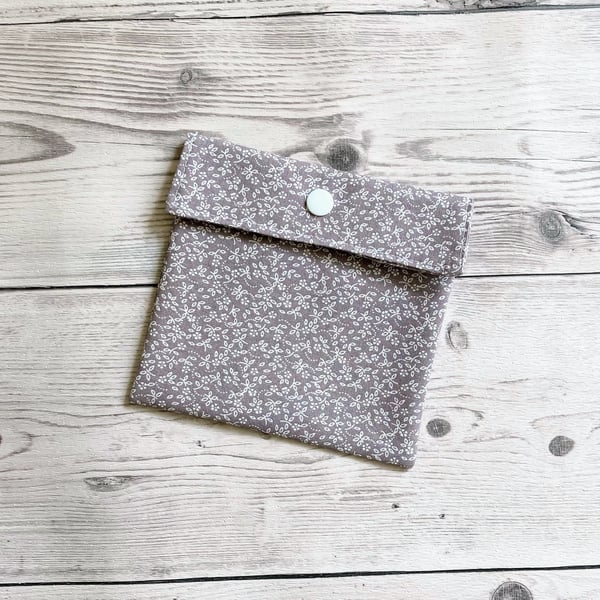 Discreet sanitary pouch. Feminine products holder. Ditsy floral grey.
