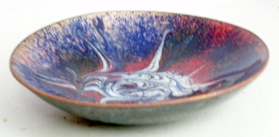 enamel dish - scrolled white and red over dark blue
