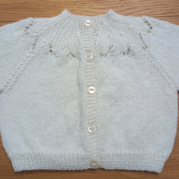 Handknitted cream baby cardigan, approx 0-3 months, to fit a 16" chest