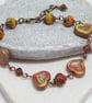 Rustic heart bracelet in red and dark yellow tones - Image 5