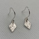 Pure silver, diamond shaped earrings with a starry pattern 