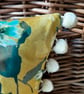 Yellow floral velvet cushion cover with blush pink cotton back and pompoms - Image 4