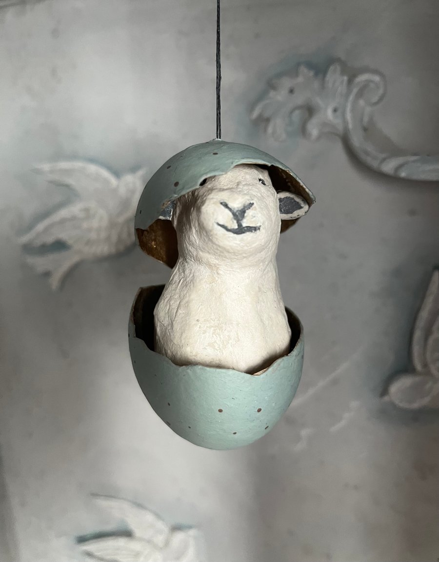 Paper mache sheep in an eggshell assemblage art