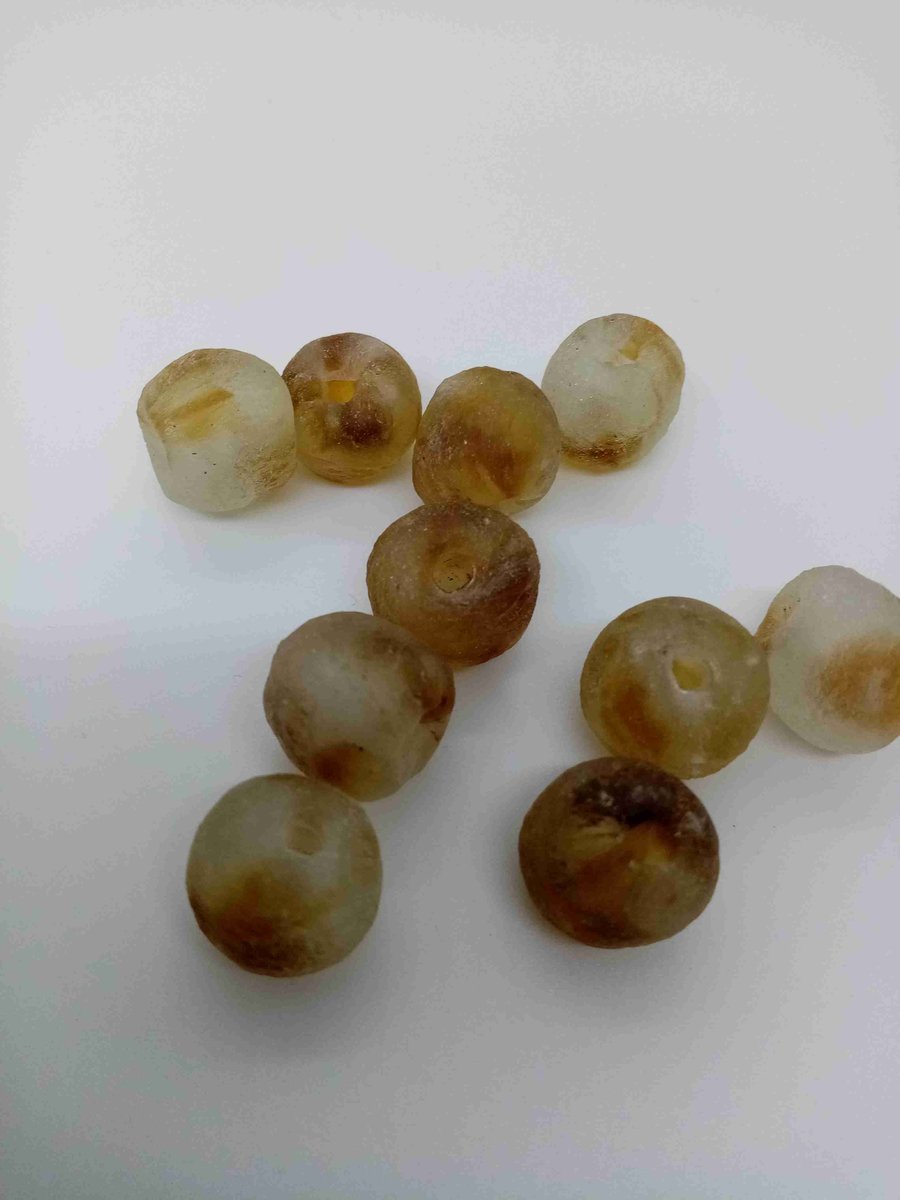 10 African round beads of recycled glass 13 - 15 mm, clear with golden brown