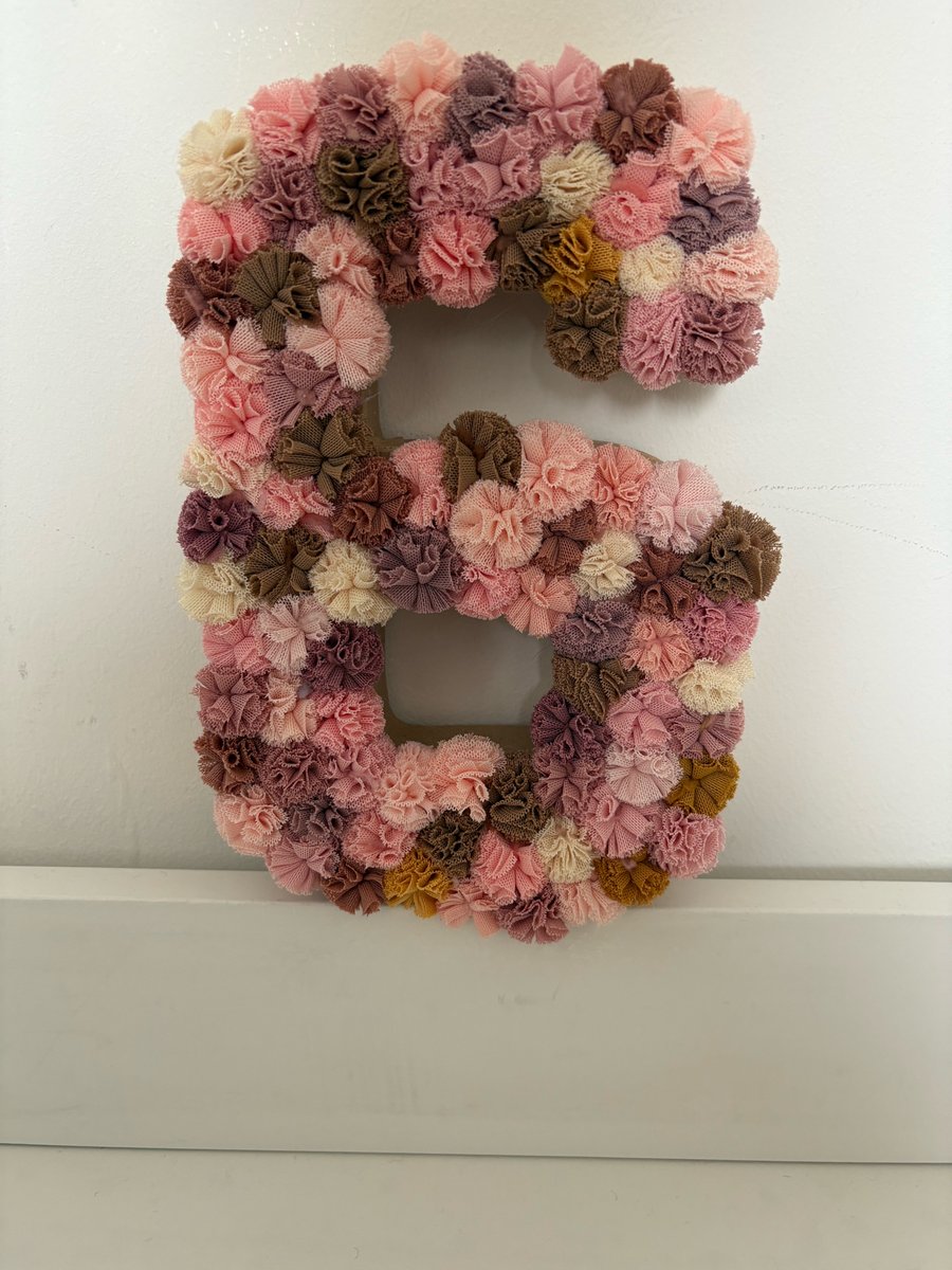 No 6 scrunchy Pom Pom number. 
