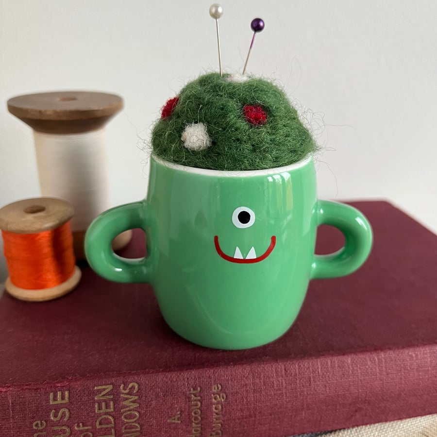 Needle felted pin cushion in repurposed green monster pot