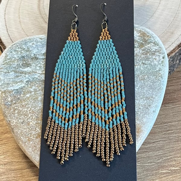 Long Native American style beaded fringe earrings in blue and bronze