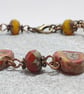 Rustic heart bracelet in red and dark yellow tones - Image 4