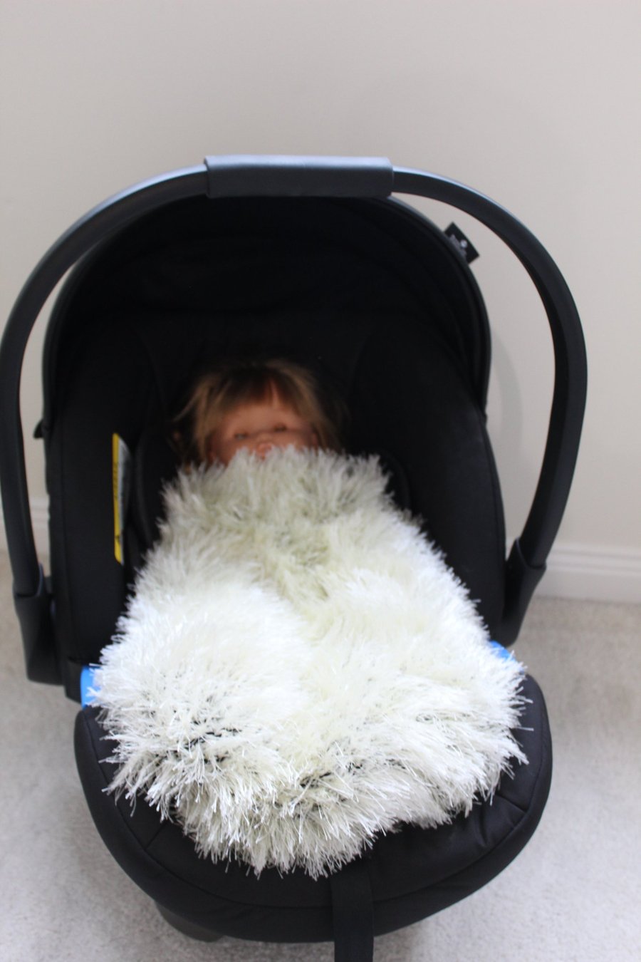 Handknitted fluffy baby blanket