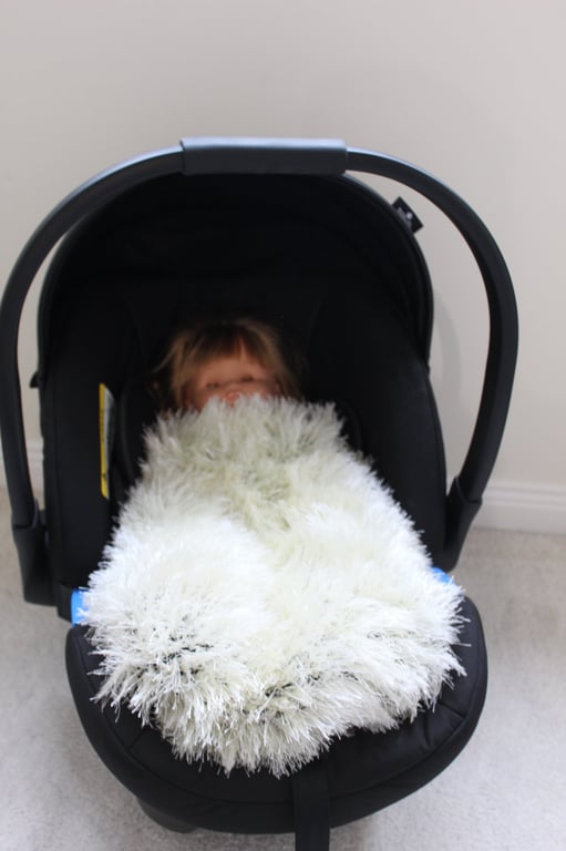 Handknitted fluffy baby blanket