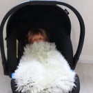 Handknitted fluffy baby blanket