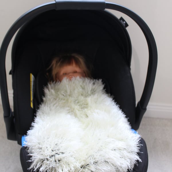 Handknitted fluffy baby blanket