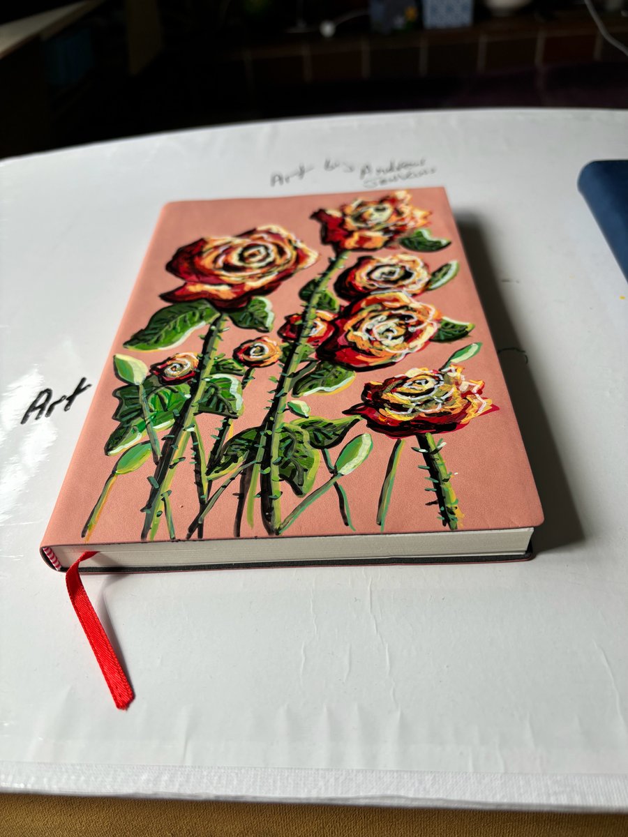 A hand painted and sealed faux leather journal by Andrew Jenkins 