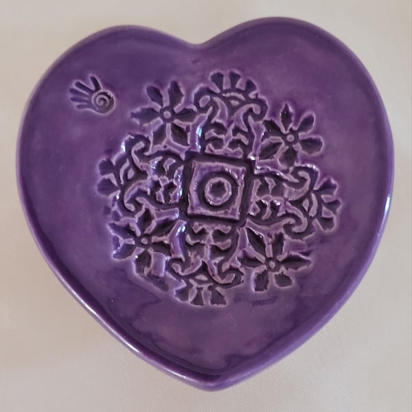 Embossed heart ring dish.