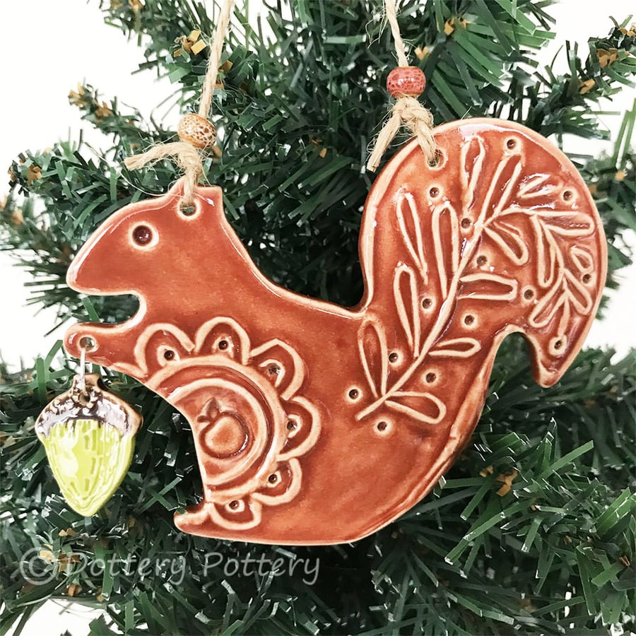 Ceramic squirrel with acorn decoration
