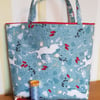 Christmas gift bag: dancing hares on blue 