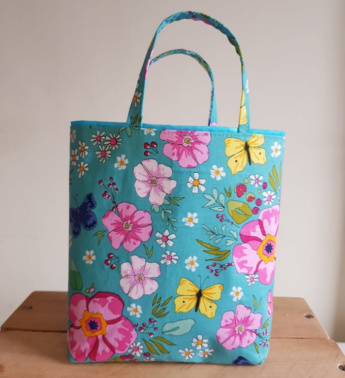 Reusable fabric gift bag: floral design on turquoise