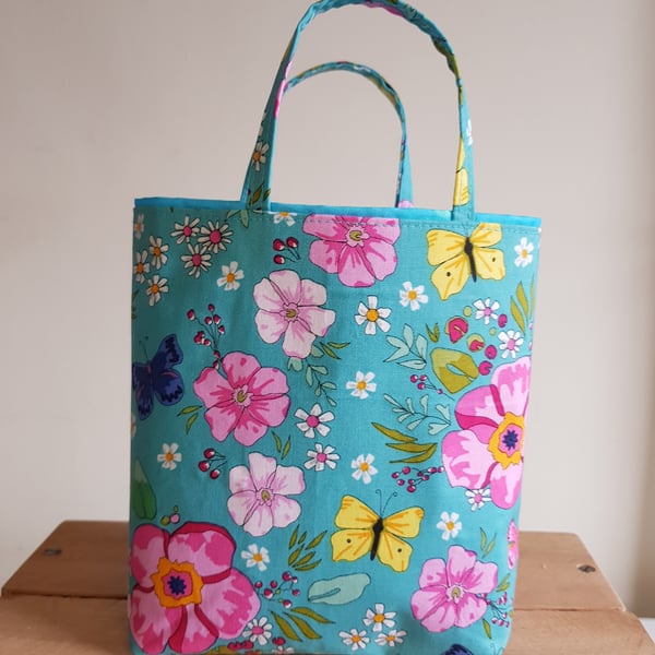 Reusable fabric gift bag: floral design on turquoise