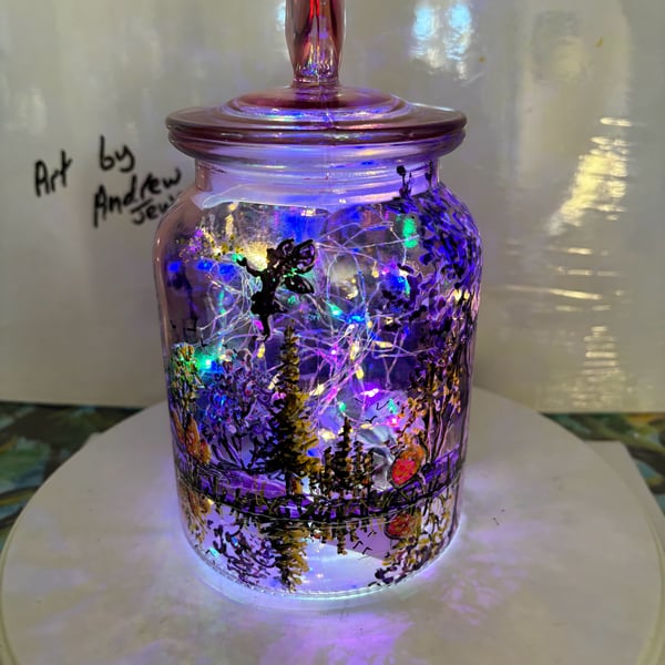 A hand painted and fired glass vase with lid by Andrew Jenkins