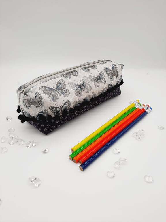 Butterfly pencil case, bobble trim and dark grey flower cotton fabric. 