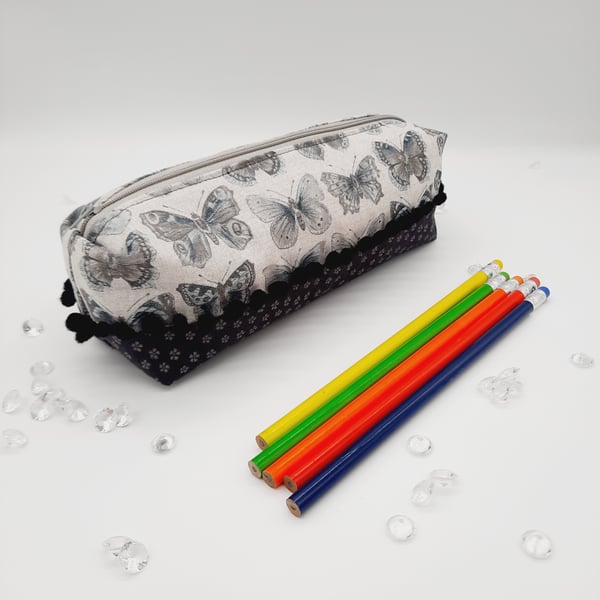 Butterfly pencil case, bobble trim and dark grey flower cotton fabric. 