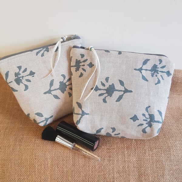 Fabric teal and natural linen zipped pouch or makeup bag with a cream lining 