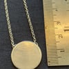 Elegant contemporary silver disc pendant on a belcher chain