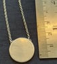 Elegant contemporary silver disc pendant on a belcher chain