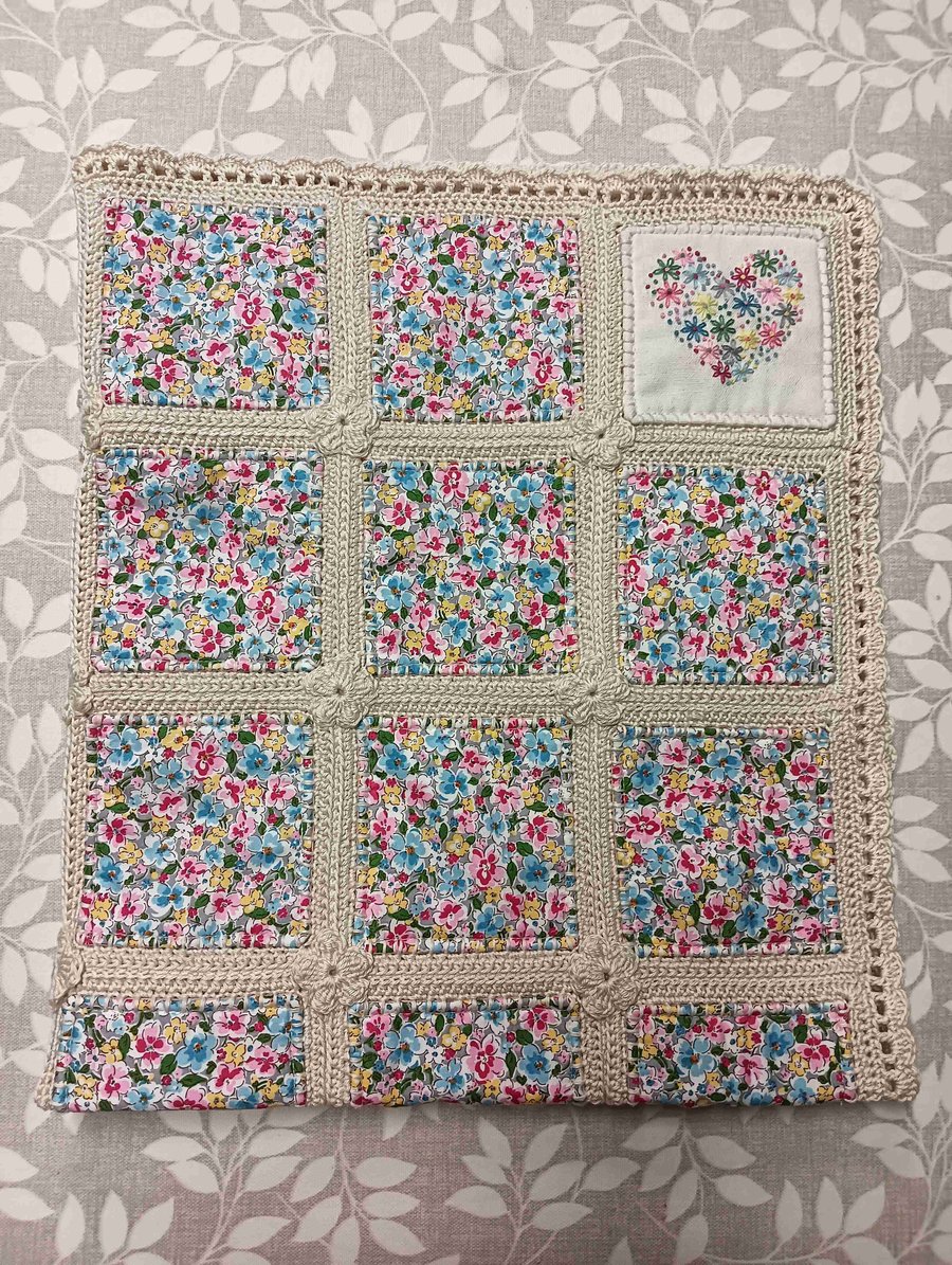 Quilted baby blanket.