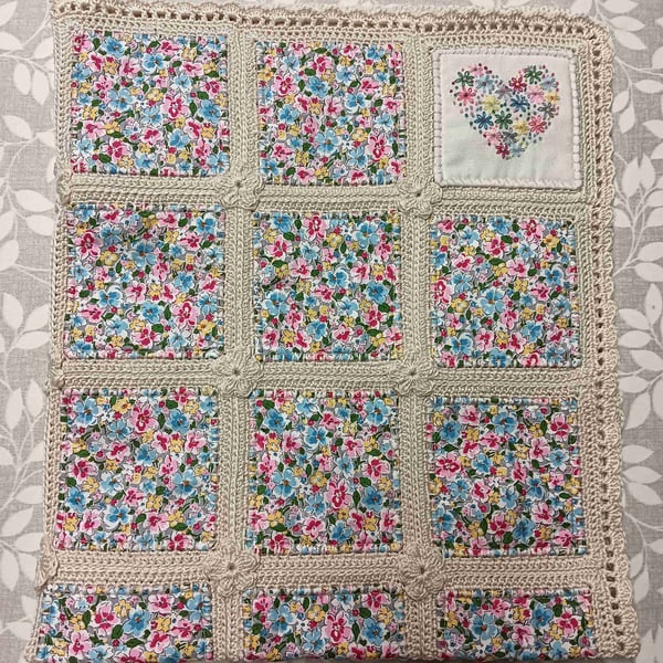 Quilted baby blanket.