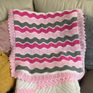 Approximately 76cm x 76cm pram blanket in pinks and greys. Ready to post 