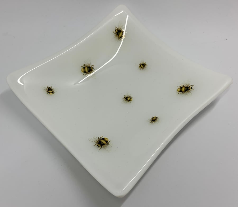 Fused glass bowl with bee design. 