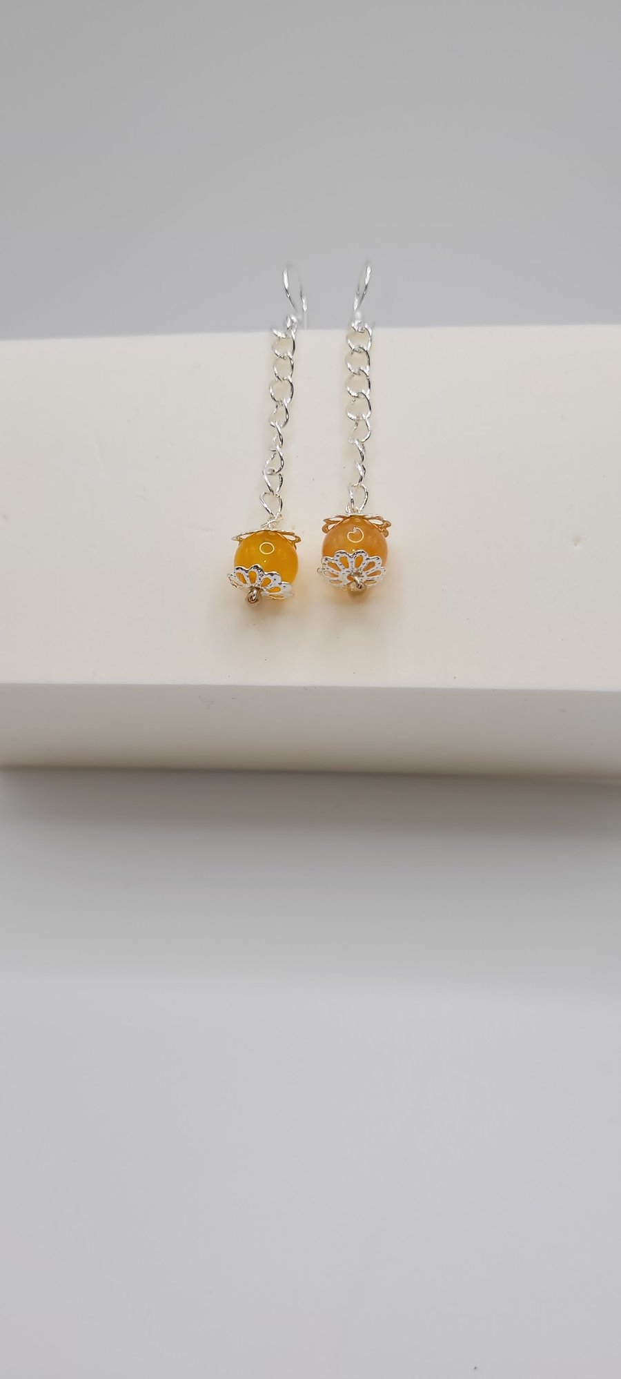 Orange coloured Agate earrings with silver  embellishment 