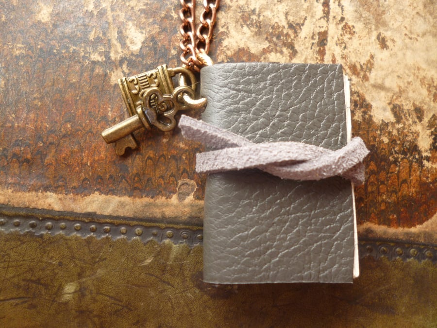 Mini book - notebook necklace: leather bound with charm