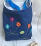Peg bag with shoulder strap. Recycled denim with flower decoration