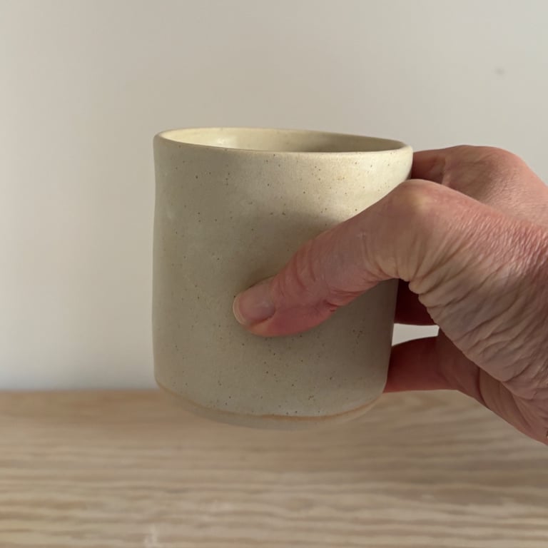 Handmade small ceramic dimple mug, cream handleless mug