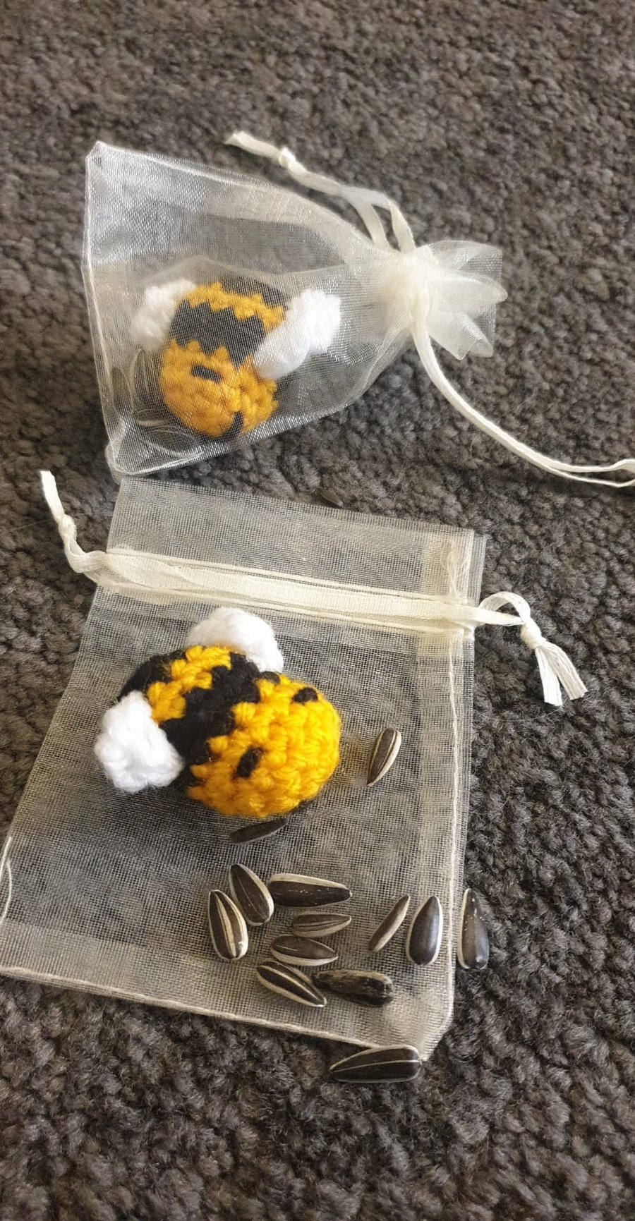 Hand made crochet bee and sunflower seeds