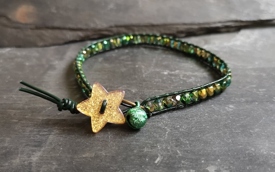 Festive green and gold leather bracelet with star button and jingly bell