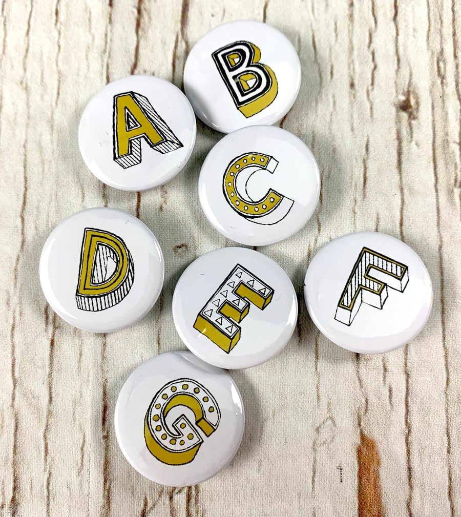 Letter button badges, alphabet personalised initial pin jewellery. 