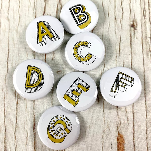 Letter button badges, alphabet personalised initial pin jewellery. 