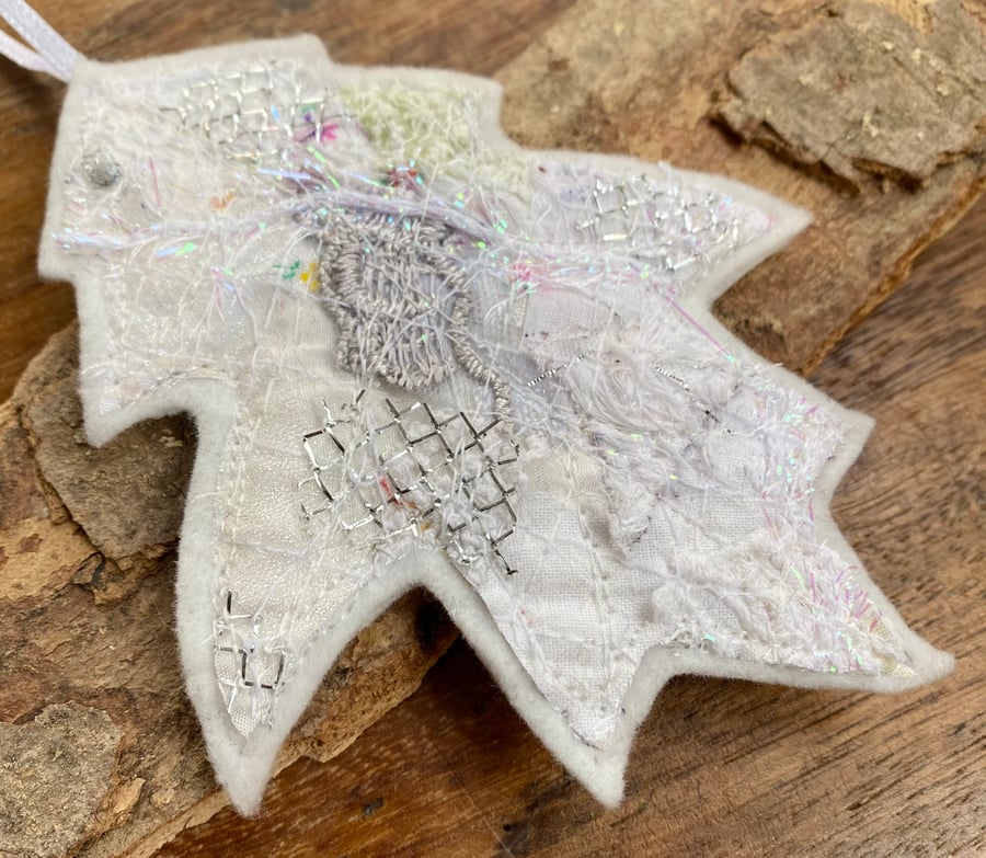 Embroidered up-cycled leaf home decoration.