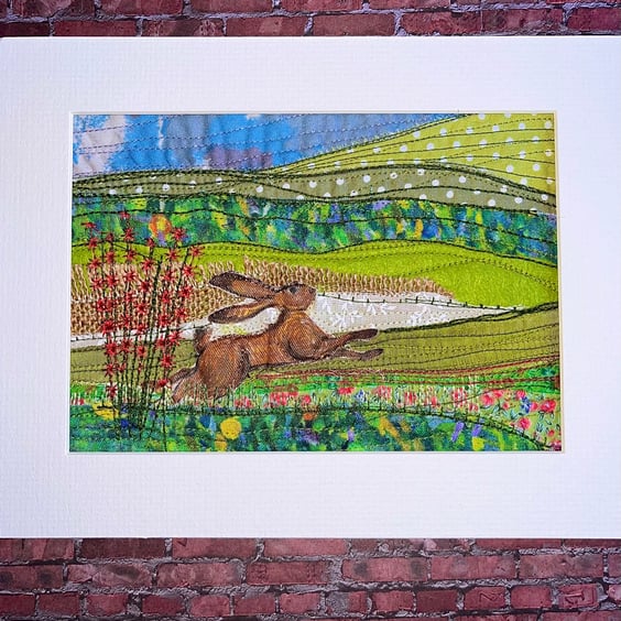 Textile unframed picture with hare in landscape 