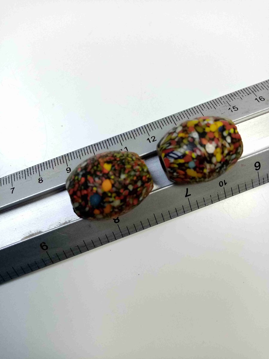 Two giant end of day barrel shaped splatter beads