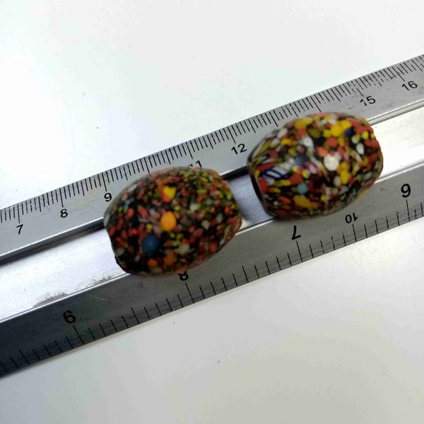 Two giant end of day barrel shaped splatter beads