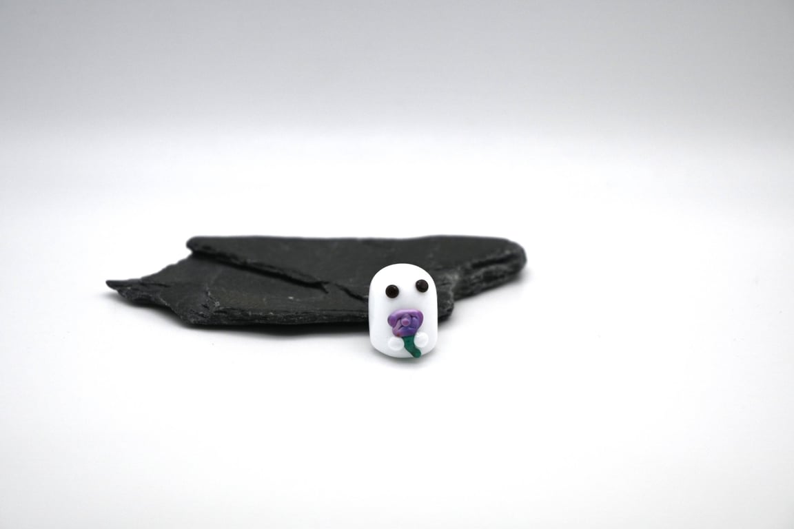 small glass ghost with flower keepsake figure