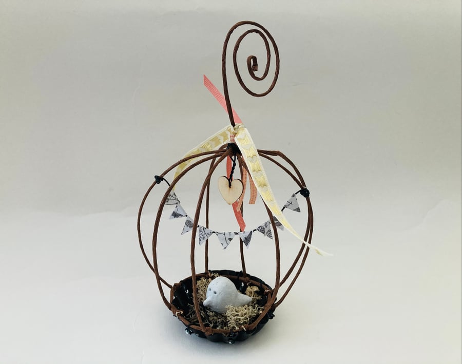 Wire bird cage sculpture