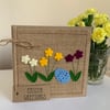 Easter greeting card with flowers and decorated egg. Handmade. Wool felt.